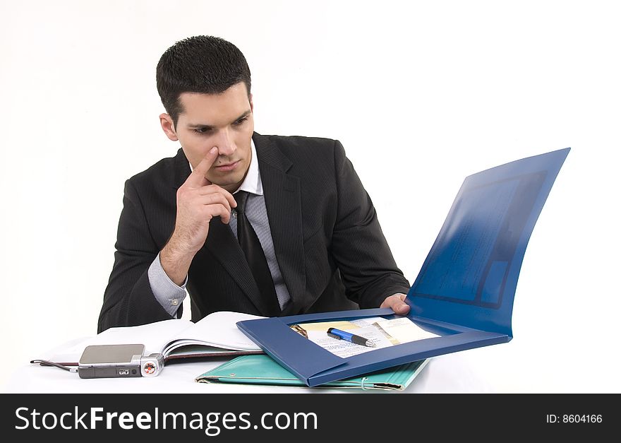 Businessman at work with phone and documents