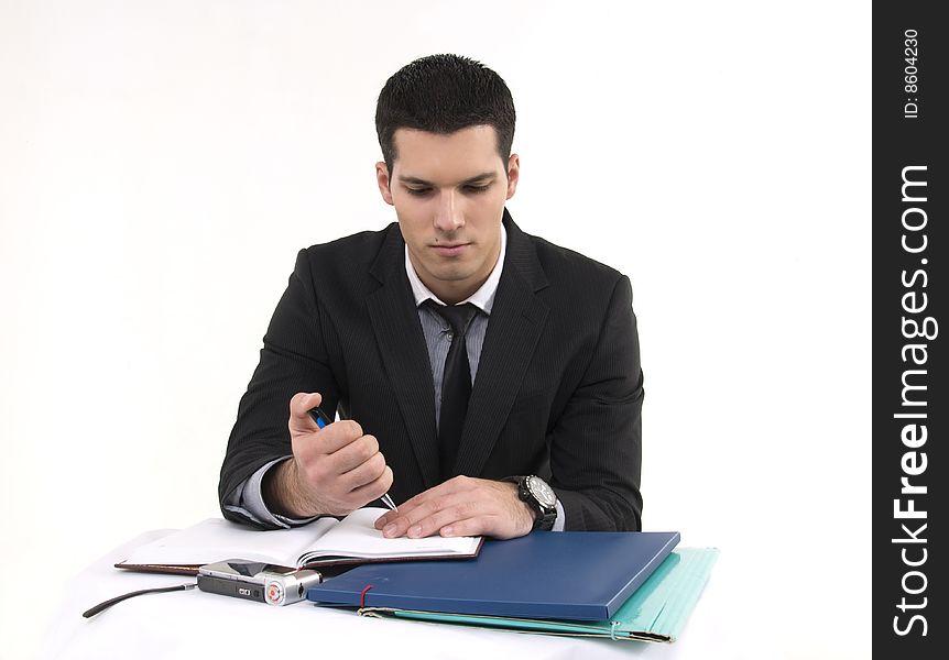 Businessman at work with phone and documents