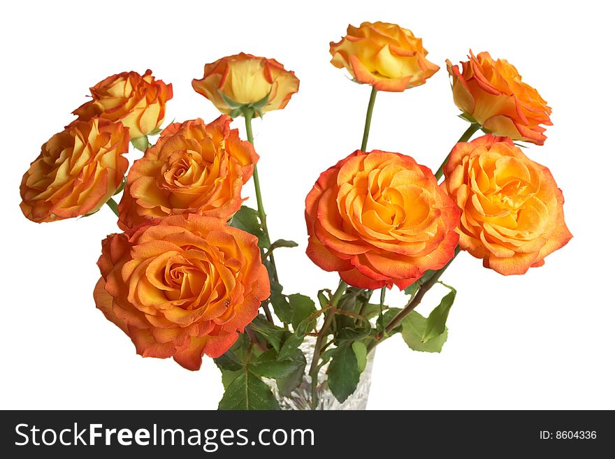 A bouquet of yellow roses in a crystal vase