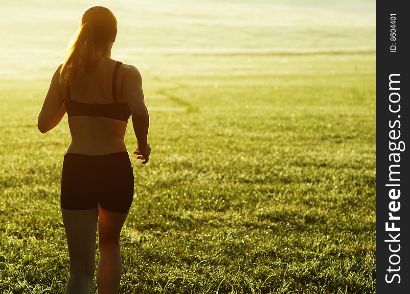 Beautiful young woman runner having a workout session. Beautiful young woman runner having a workout session.