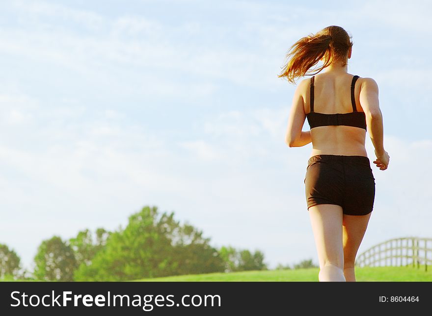 Beautiful young woman runner having a workout session. Beautiful young woman runner having a workout session.