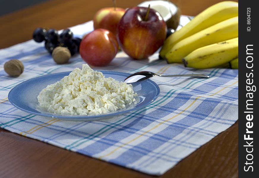 Still life on the table with curd and fruit. Still life on the table with curd and fruit