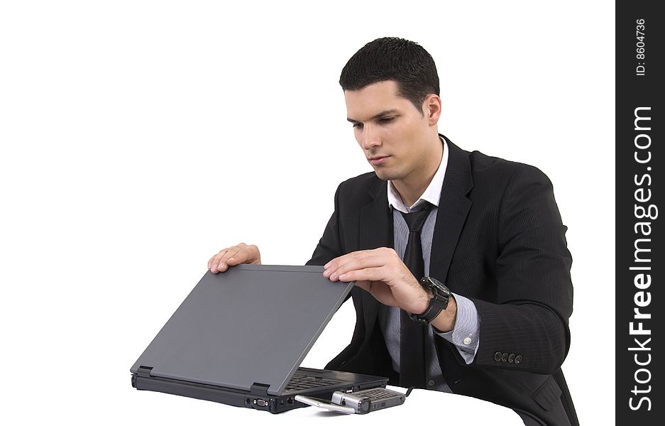 Businessman with lap top computer and phone