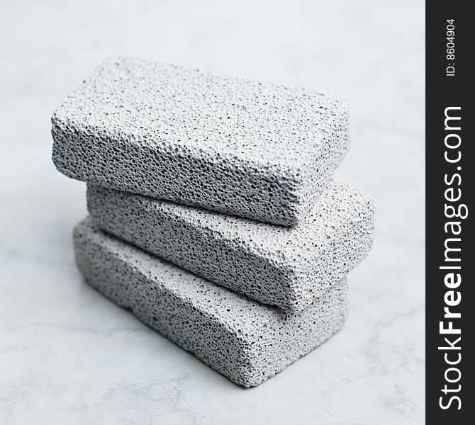 A stack of pumice stones against a white background. A stack of pumice stones against a white background.