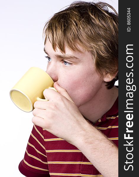 Teenage boy drinking coffee isolated on white background. Teenage boy drinking coffee isolated on white background