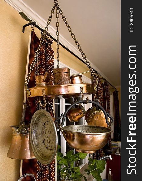A decorative set of textured brass utensils. A decorative set of textured brass utensils
