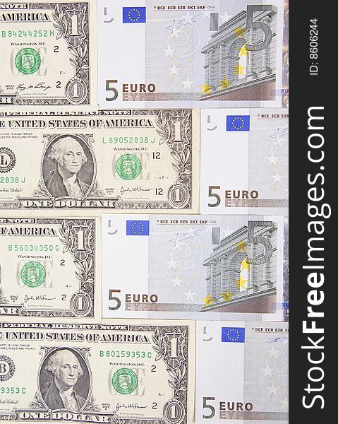 Arranged dollars and euro made as background. Arranged dollars and euro made as background