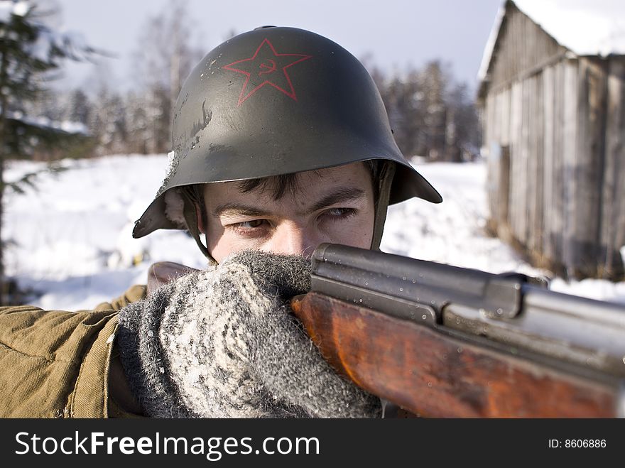 Soviet-Finnish war 1939-1940: Red Army soldier aims from a rifle