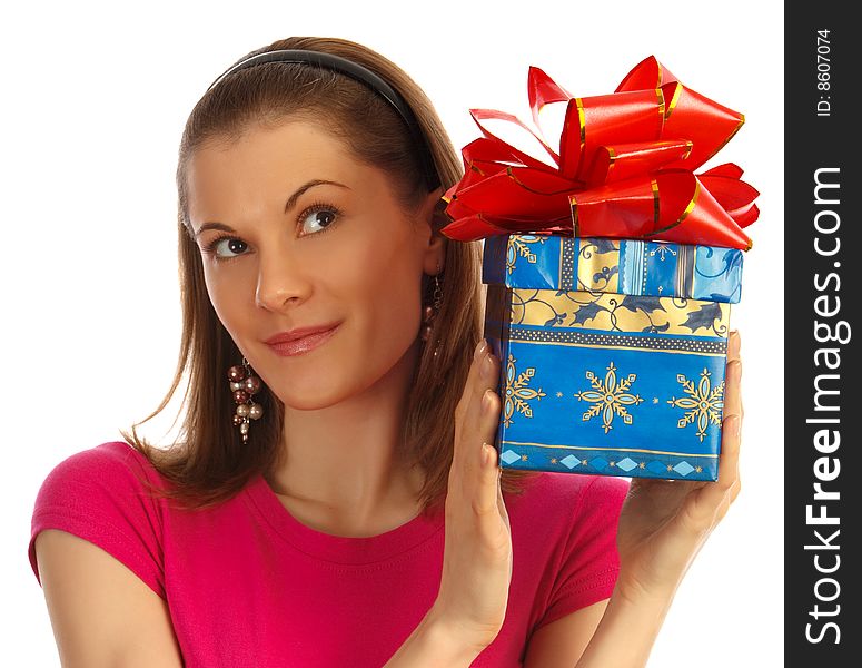 Nice girl holding a gift. Isolated on white