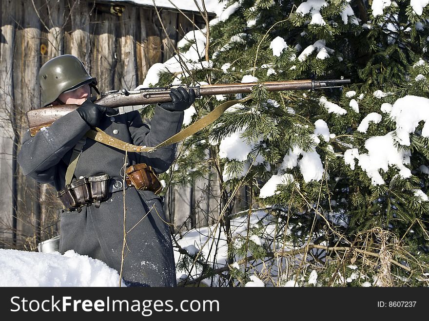 Finnish soldier aims from a rifle