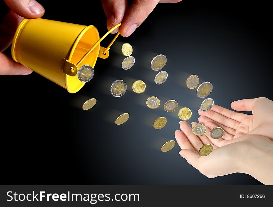 Coins falling to hands over black background. Coins falling to hands over black background.