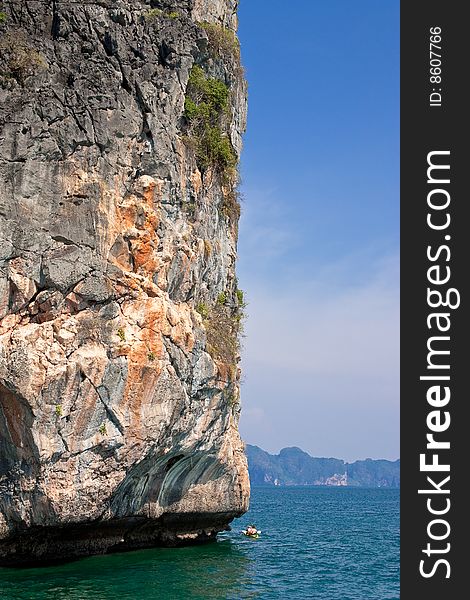 Canoist travelling around the island of southern Thailand sea. Canoist travelling around the island of southern Thailand sea.