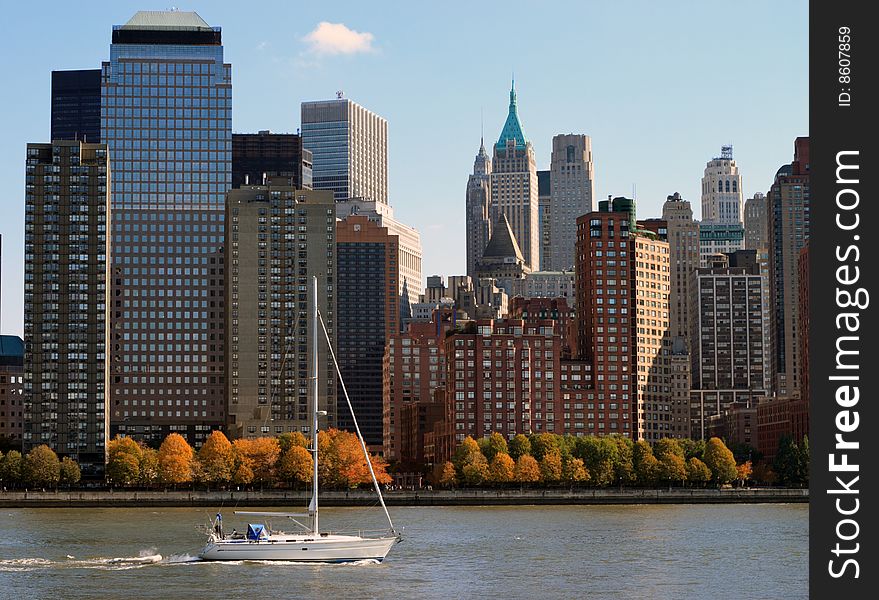 Sail boat cruising with Manhattan at the background