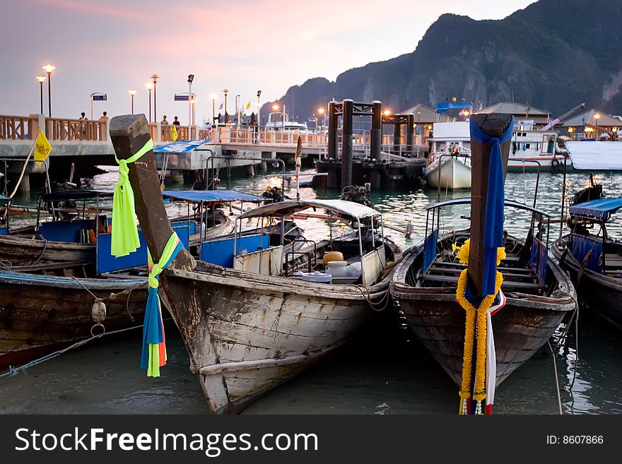 Longtail boats at sunset