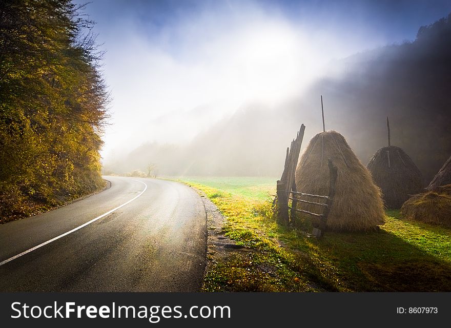 Sunrise on a country road. Foggy autumn morning. Sunrise on a country road. Foggy autumn morning