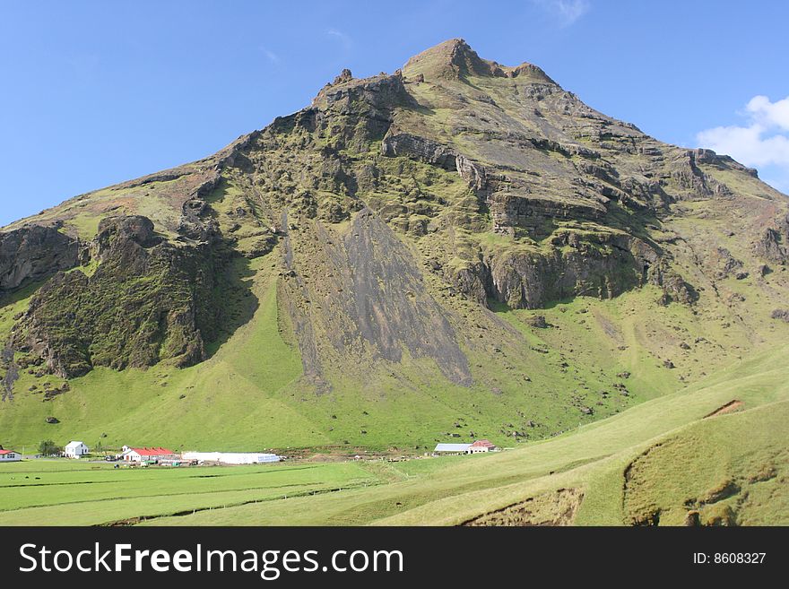 Massive Mountains Behing Clear Blue Sky