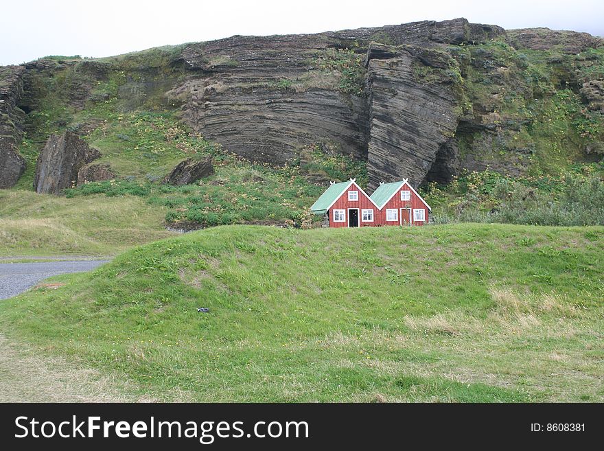 Lodges built in front of a cliff. Lodges built in front of a cliff