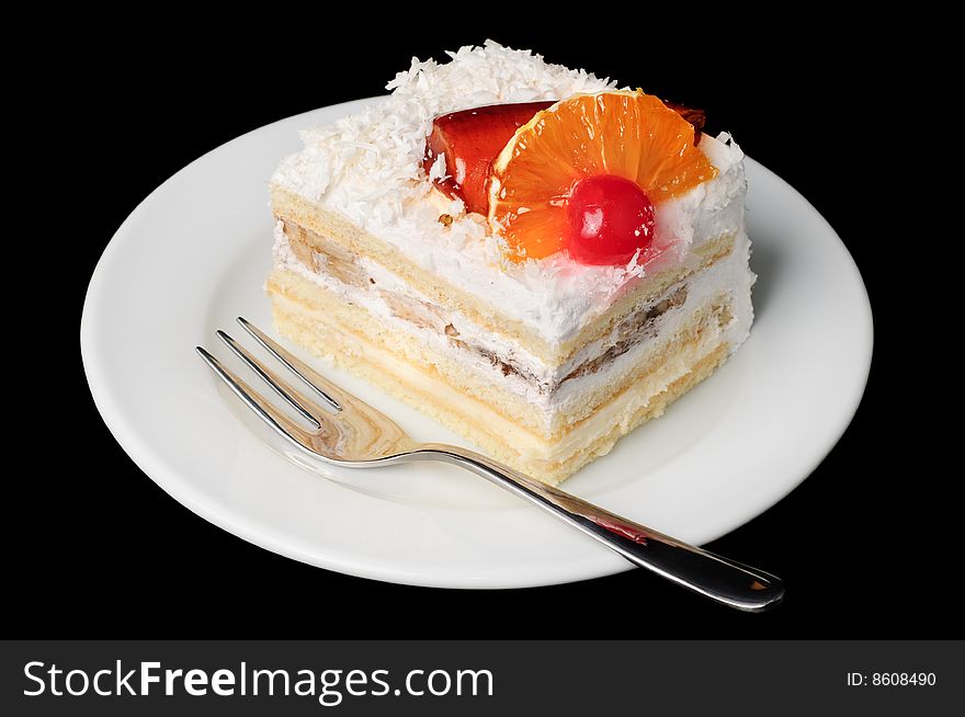 Piece of fancy creamy tart with fruits on top