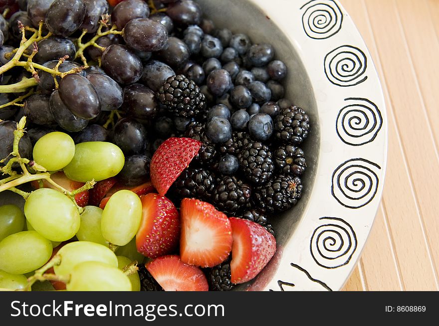 Fresh Fruit Platter with strawberries, blueberries, blackberries, and green and red grapes.