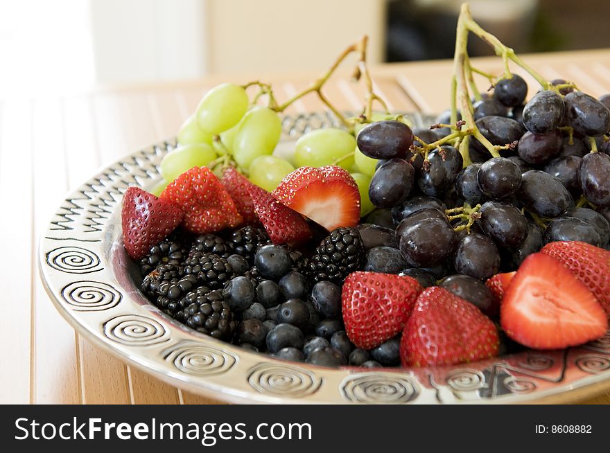 Fresh Fruit Platter with strawberries, blueberries, blackberries, and green and red grapes.