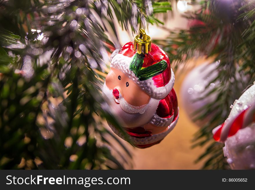 Santa Claus Ornament Hanging On Christmas Tree