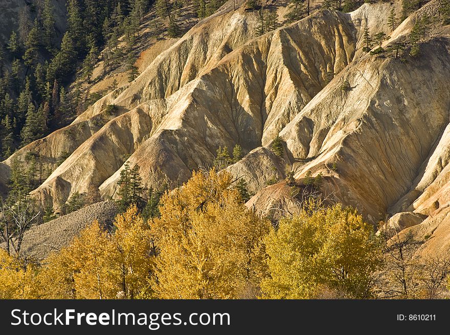 Many years of erosion has gouged deep ravines into this hillside near Clinton, BC Canada. Many years of erosion has gouged deep ravines into this hillside near Clinton, BC Canada