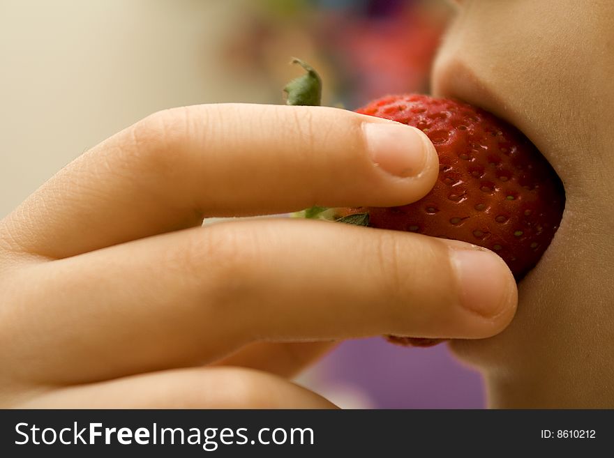 Strawberry inside the child\'s mouth. Strawberry inside the child\'s mouth.