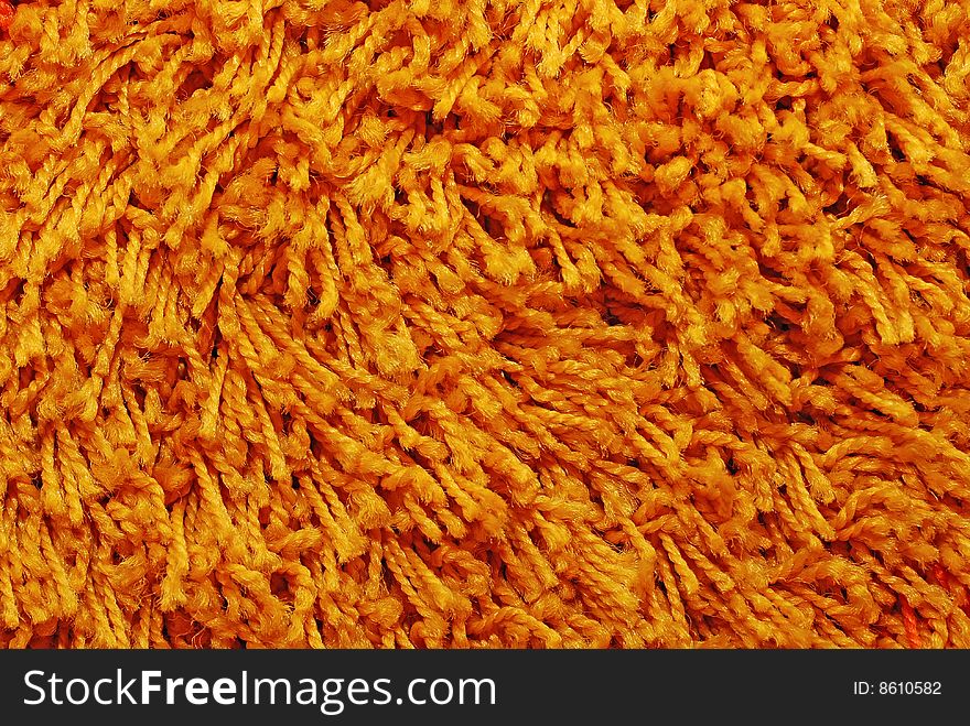 Orange carpet texture, close-up view