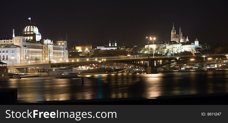 Night panorama of Prague castle and New Town with reflection in Vltava river. Night panorama of Prague castle and New Town with reflection in Vltava river.