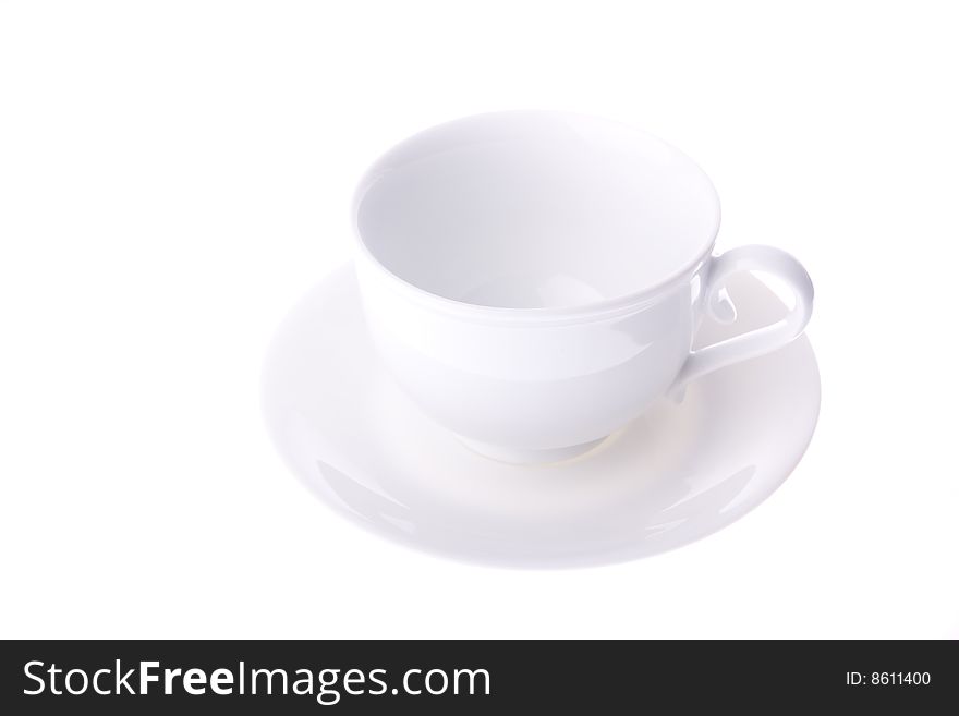 Empty white cup with saucer