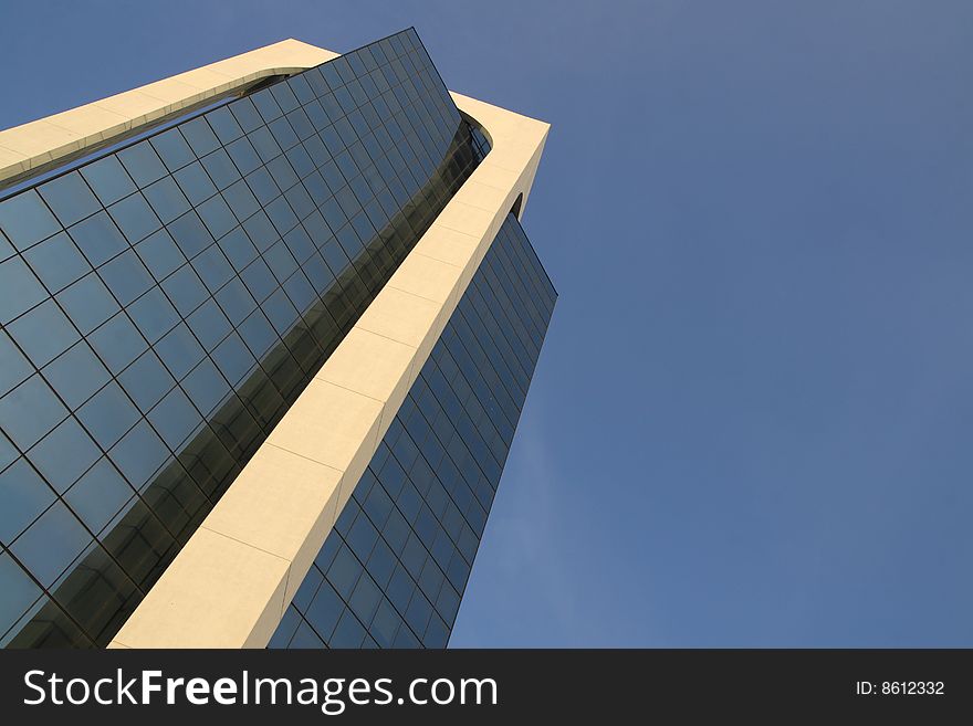 A modern building made of glass in Sesto San Giovanni, Italy. A modern building made of glass in Sesto San Giovanni, Italy