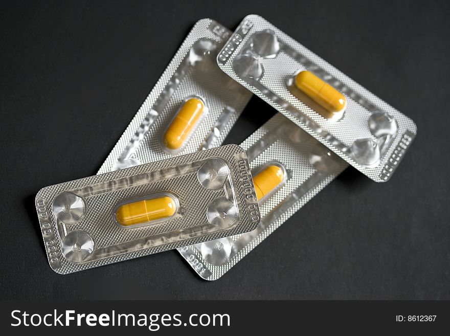 Gelatine capsules with medicine in aluminium packages