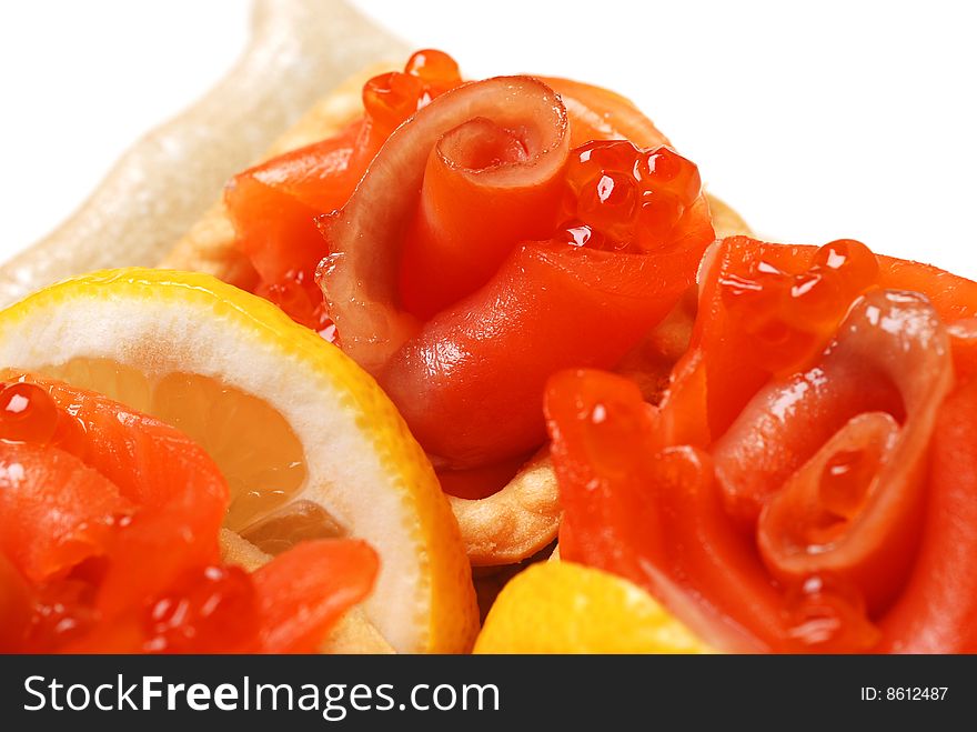 Red fish, caviar and slices of lemon