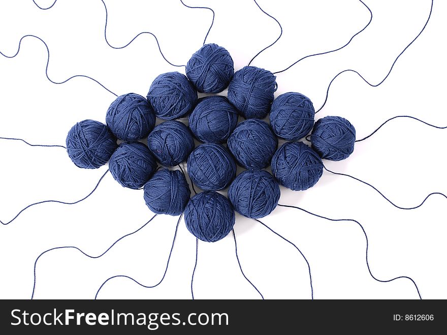 Blue threads and clews  isolated on a white background. Blue threads and clews  isolated on a white background