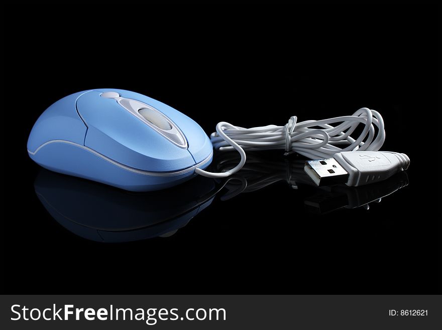 Close up of USB optical mouse isolated on black background. Close up of USB optical mouse isolated on black background.