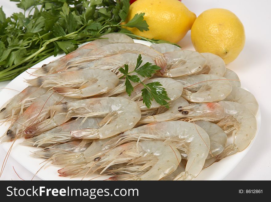 Shrimps on white bowl with lemon