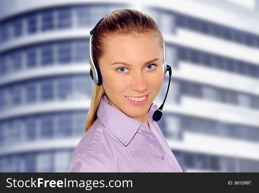 Woman wearing headset in office; could be receptionist