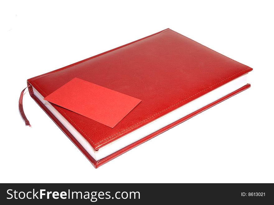Red weekly and business card which lies on him isolated on white