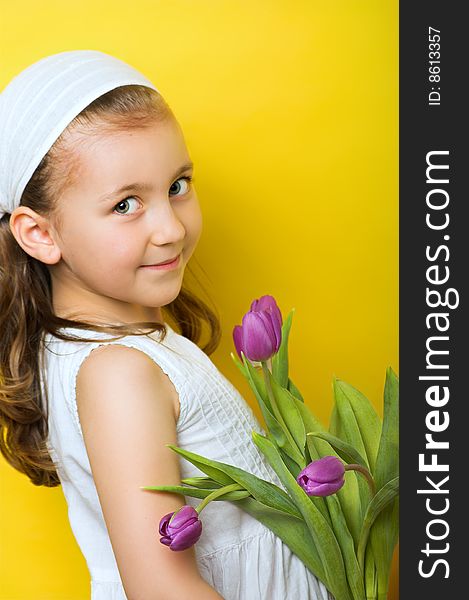 Little smiling girl with flowers