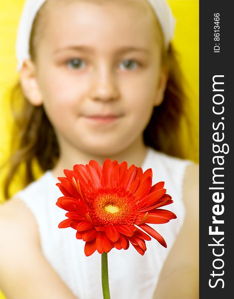 Smiling beautiful young girl with a flower at spring. Smiling beautiful young girl with a flower at spring