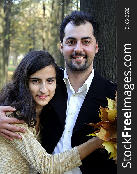 Young man and woman in the autumn forest. Young man and woman in the autumn forest
