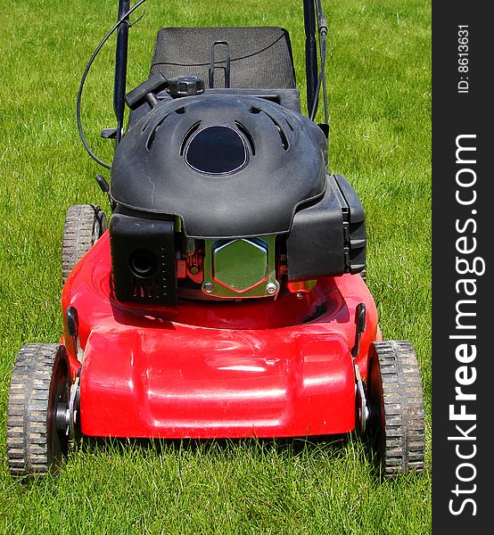 Lawn mower in the  grass