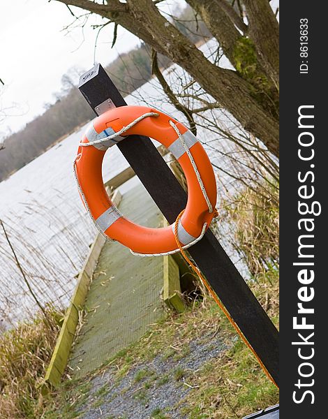 Lake side jetty with a life buoy. Lake side jetty with a life buoy