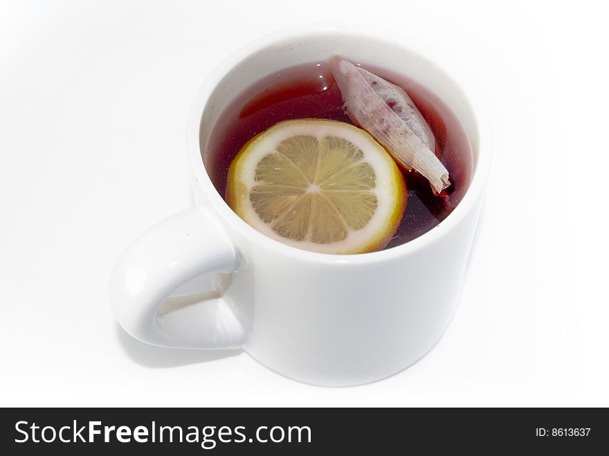 White cup of tea with lemon isolated on white. White cup of tea with lemon isolated on white