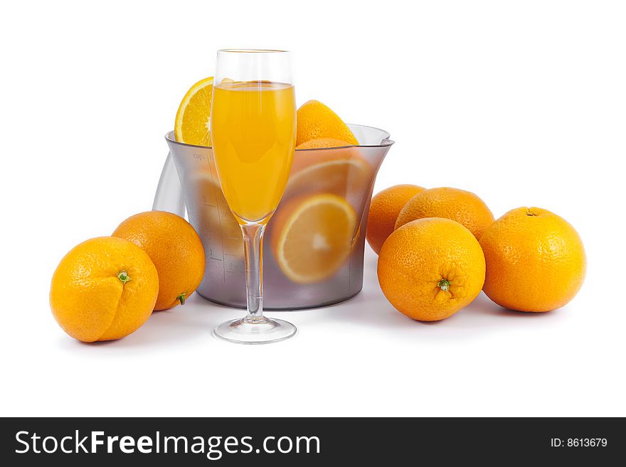 Oranges and glass of juice isolated on white. Oranges and glass of juice isolated on white