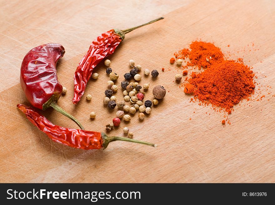 Dry red chili paprika and pepper on wooden board. Dry red chili paprika and pepper on wooden board