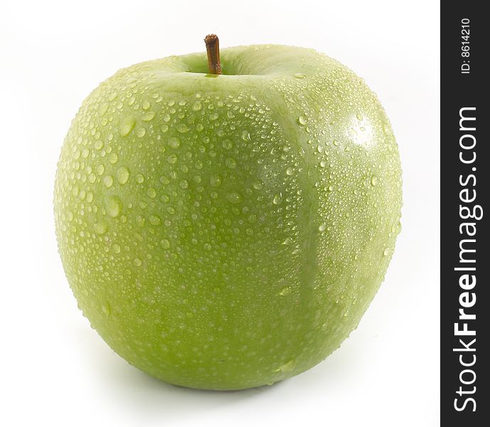 Wet green apple fruit on table