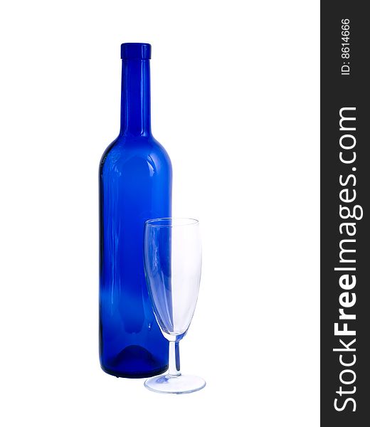 An empty bottle and wineglass isolated on white