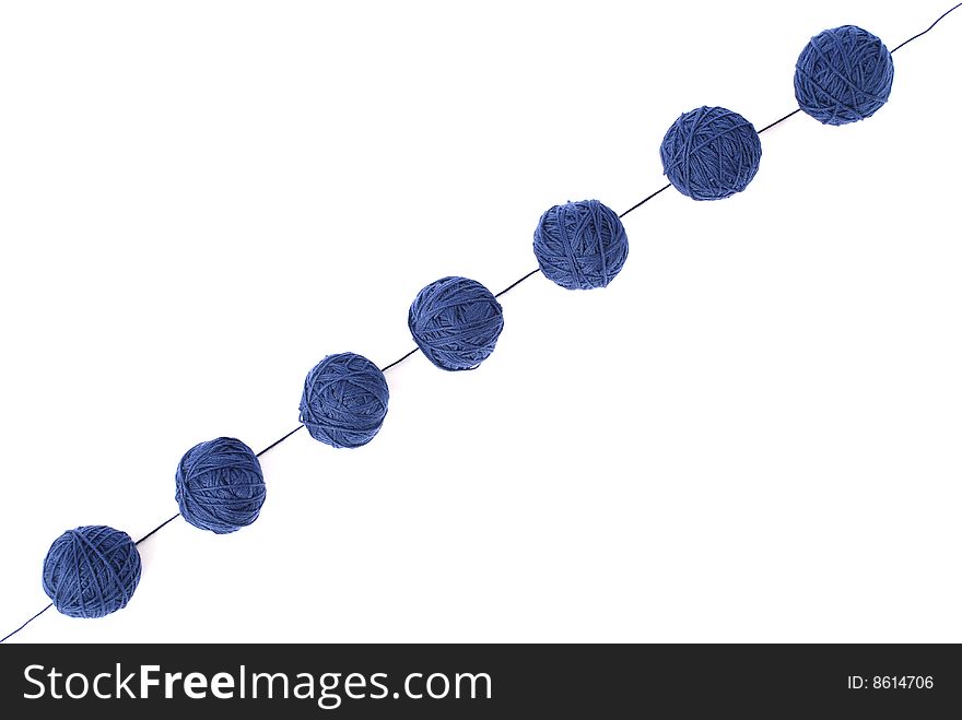 Blue thread and clews  isolated on a white background. Blue thread and clews  isolated on a white background