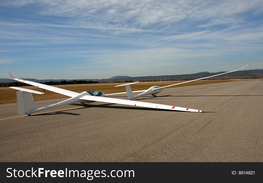 Two white gliders in an aerodrome in south of France. Two white gliders in an aerodrome in south of France